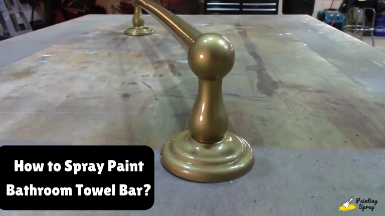 golden spray painted bathroom towel bar