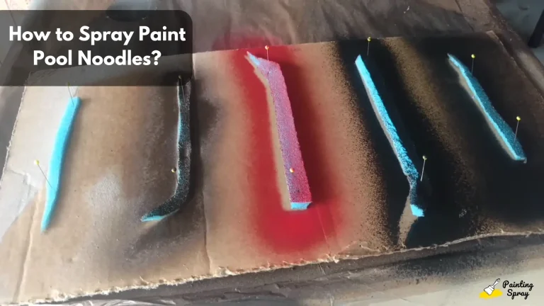 spray painted pool noodles left for drying on cardboard